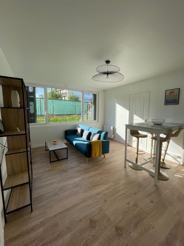 Photo 1: Salon / Salle à manger