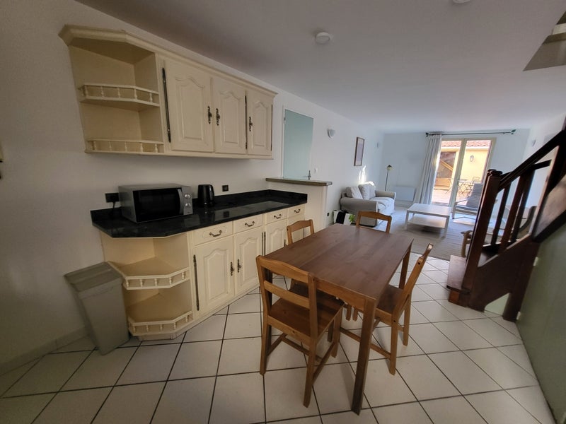 Photo 1: RDC cuisine-salon-cour