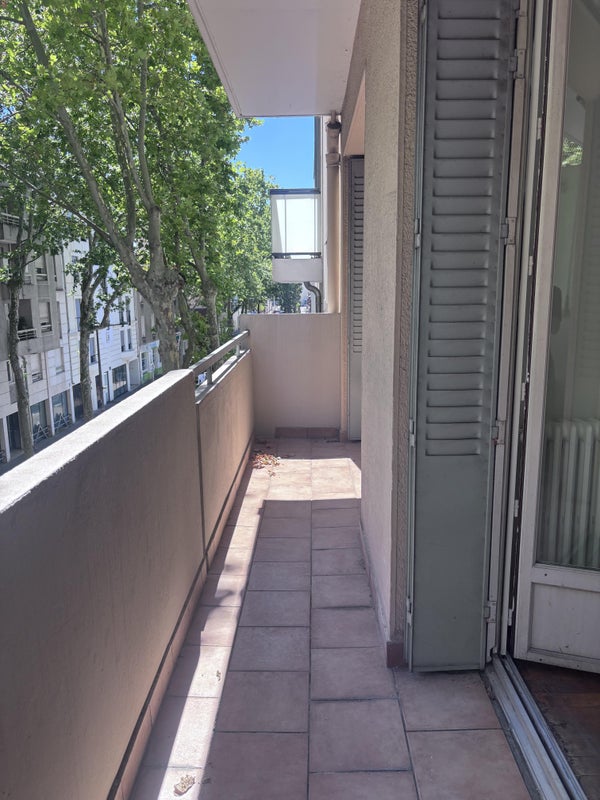 Photo 1: balcon donnant sur chambre et salon